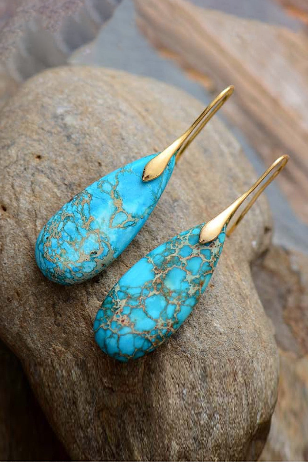 Handmade teardrop shape dangle earrings featuring natural stones, copper, and gold plating, showcasing unique patterns and modern design.