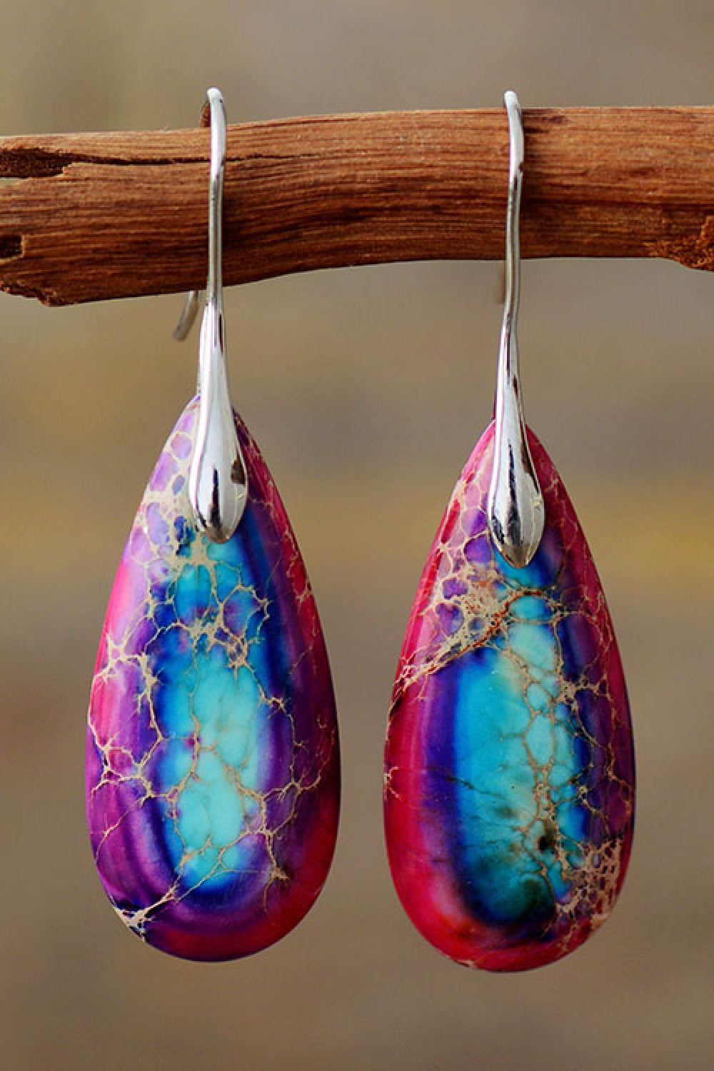 Handmade teardrop shape dangle earrings featuring natural stones, copper, and gold plating, showcasing unique patterns and modern design.