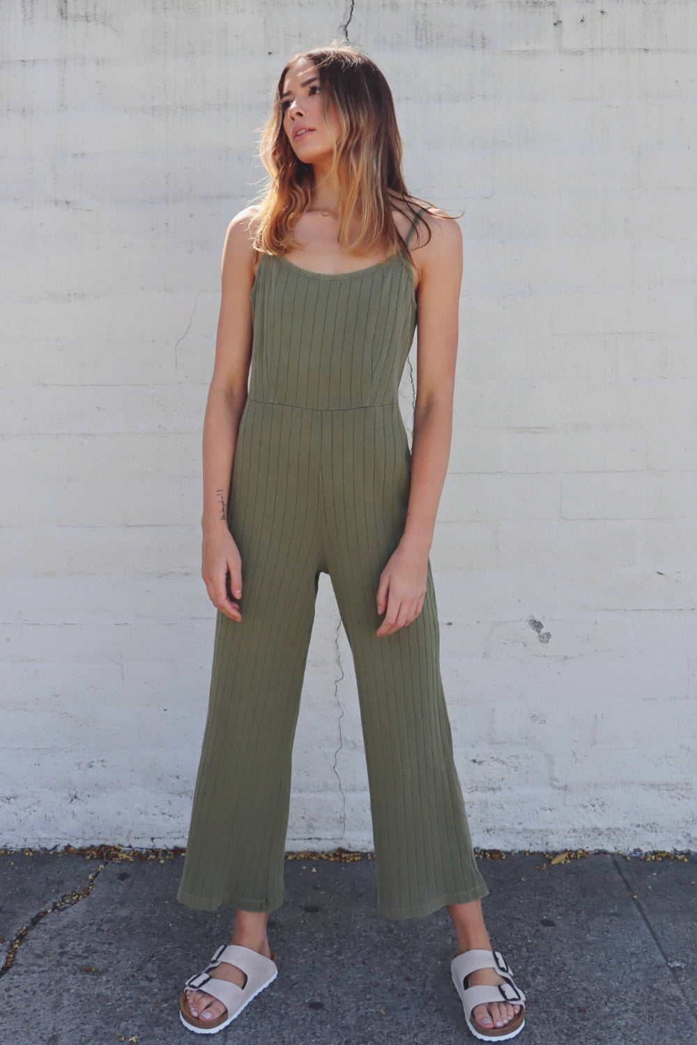 A stylish Happy Jumpsuit in Olive and Sky Blue, showcasing its comfortable fit and organic cotton fabric.