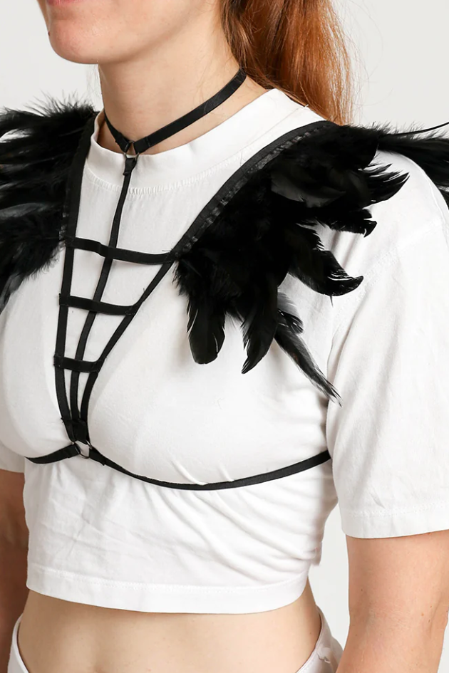 Stylish harness belt bra featuring elastic straps and decorative feathers on the shoulders, designed for a bold fashion statement.