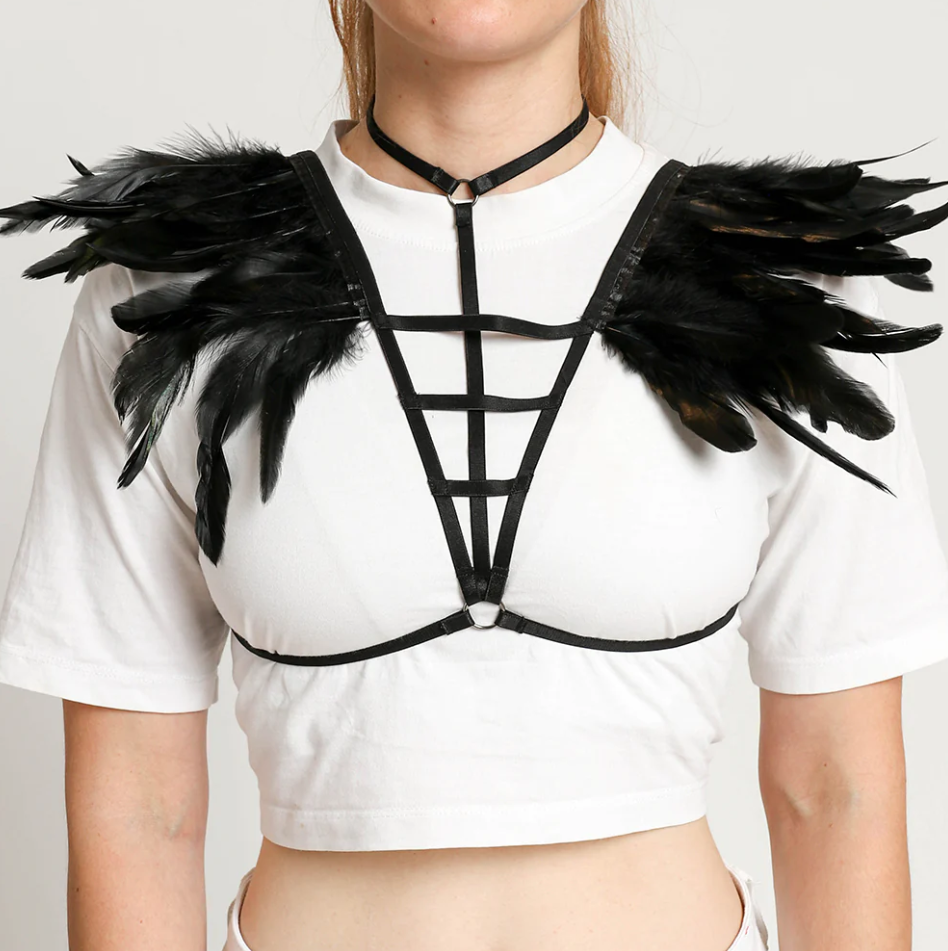 Stylish harness belt bra featuring elastic straps and decorative feathers on the shoulders, designed for a bold fashion statement.