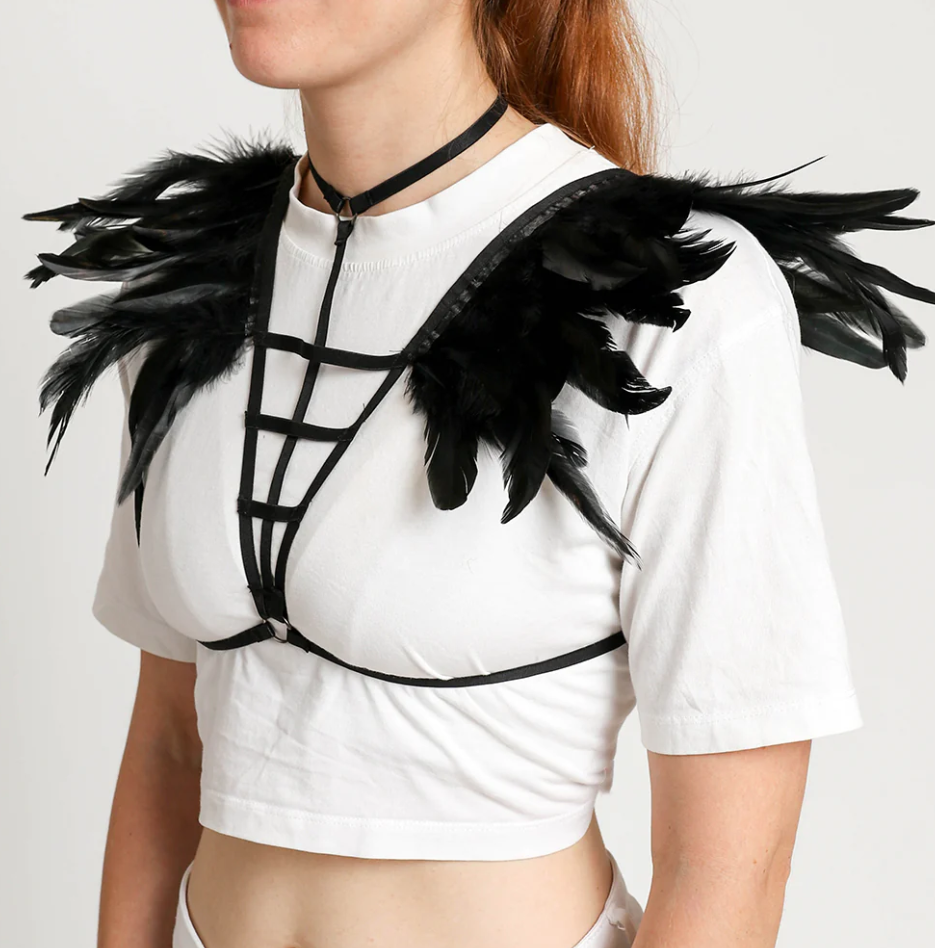 Stylish harness belt bra featuring elastic straps and decorative feathers on the shoulders, designed for a bold fashion statement.