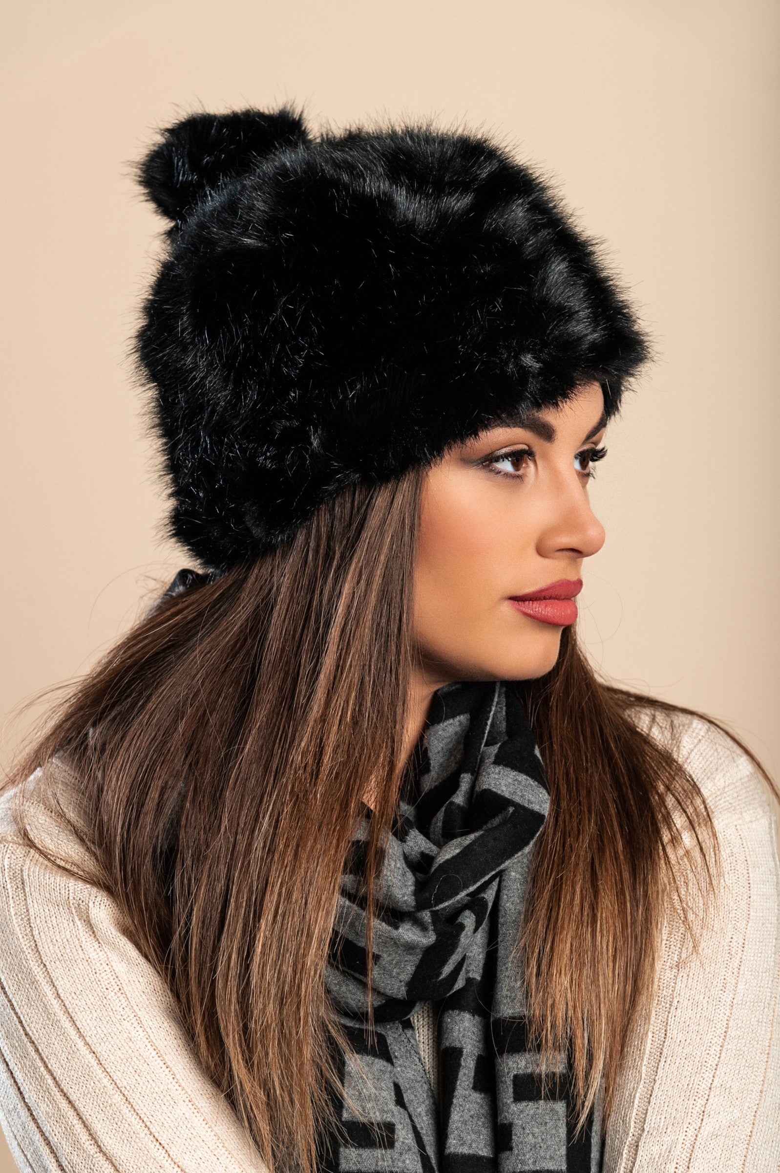 Elegant black hat with synthetic fur, showcasing its luxurious texture and stylish design.