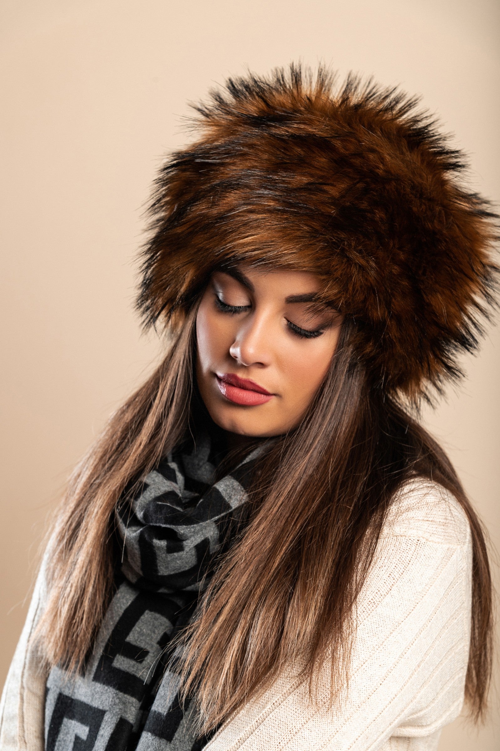 Elegant dark brown hat with soft synthetic fur lining, perfect for winter wear.