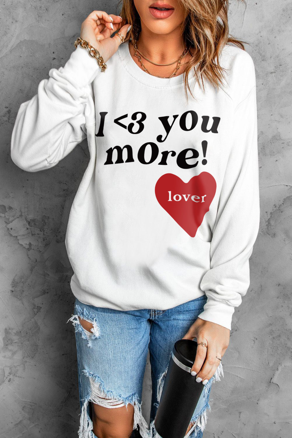 Heart Letter Graphic Long Sleeve Sweatshirt in a studio setting, showcasing its casual chic design and ribbed details.