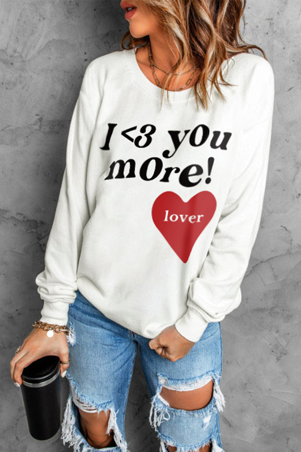 Heart Letter Graphic Long Sleeve Sweatshirt in a studio setting, showcasing its casual chic design and ribbed details.