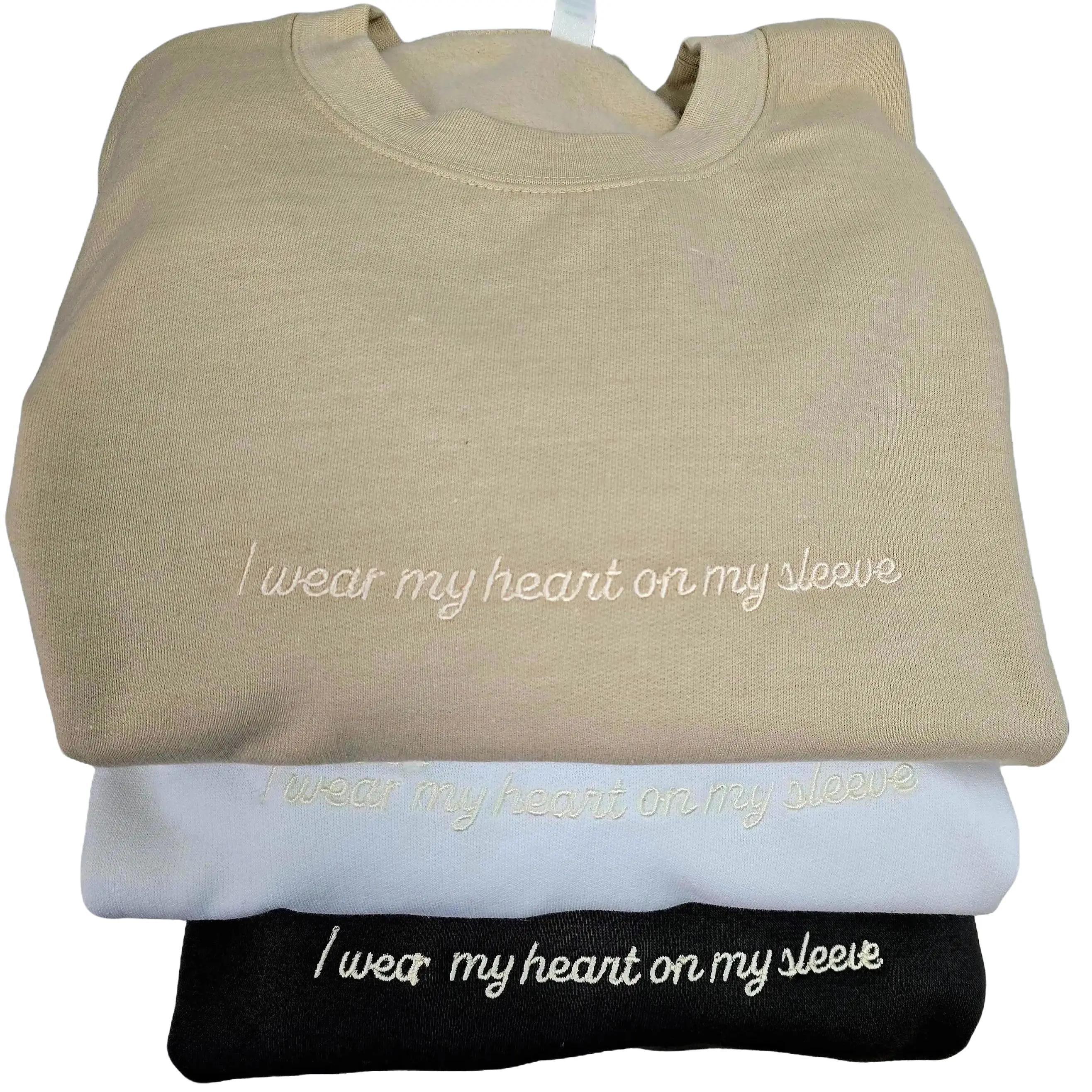 Cozy sweatshirt and hoodie with 'I wear my heart on my sleeve' design, personalized with a pet's face or name.