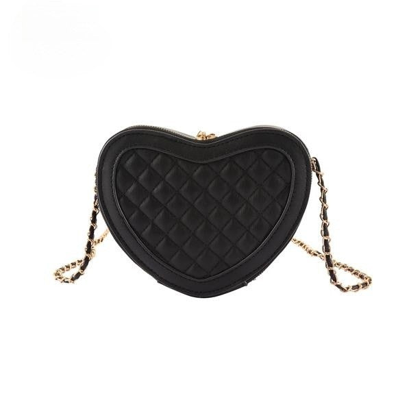 A stylish heart shaped crossbody bag with a textured quilted pattern and gold tone chain strap, perfect for evening events.