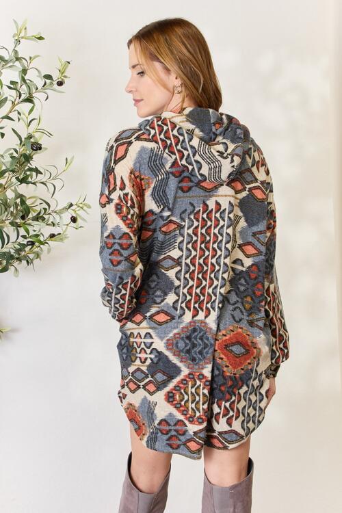 Heimish Full Size Printed Button Up Hooded Jacket featuring a vibrant multi-color print and long puff sleeves, perfect for stylish layering.