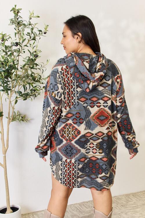 Heimish Full Size Printed Button Up Hooded Jacket featuring a vibrant multi-color print and long puff sleeves, perfect for stylish layering.