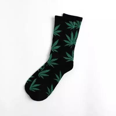 A pair of soft cotton socks featuring a vibrant hemp leaf design, perfect for cannabis enthusiasts.