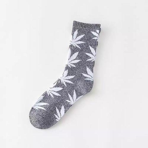 A pair of soft cotton socks featuring a vibrant hemp leaf design, perfect for cannabis enthusiasts.