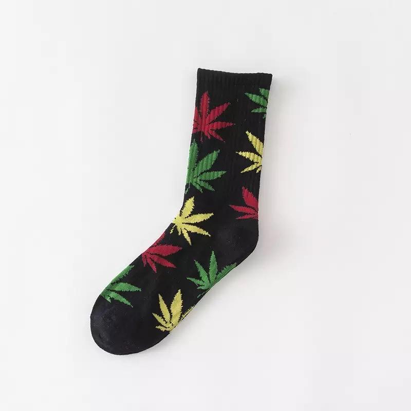 A pair of soft cotton socks featuring a vibrant hemp leaf design, perfect for cannabis enthusiasts.