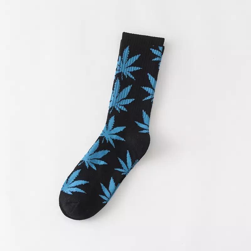 A pair of soft cotton socks featuring a vibrant hemp leaf design, perfect for cannabis enthusiasts.