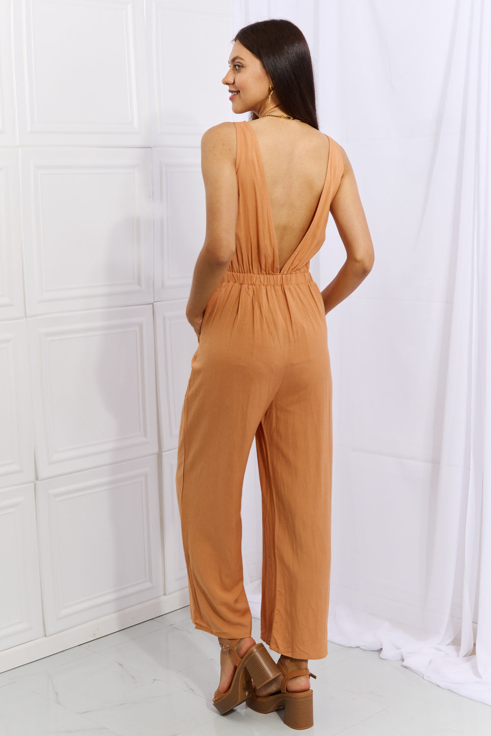 HEYSON Feels Right Wide Leg Jumpsuit in Sherbet featuring cut-out details and a flowing silhouette, perfect for warm weather occasions.