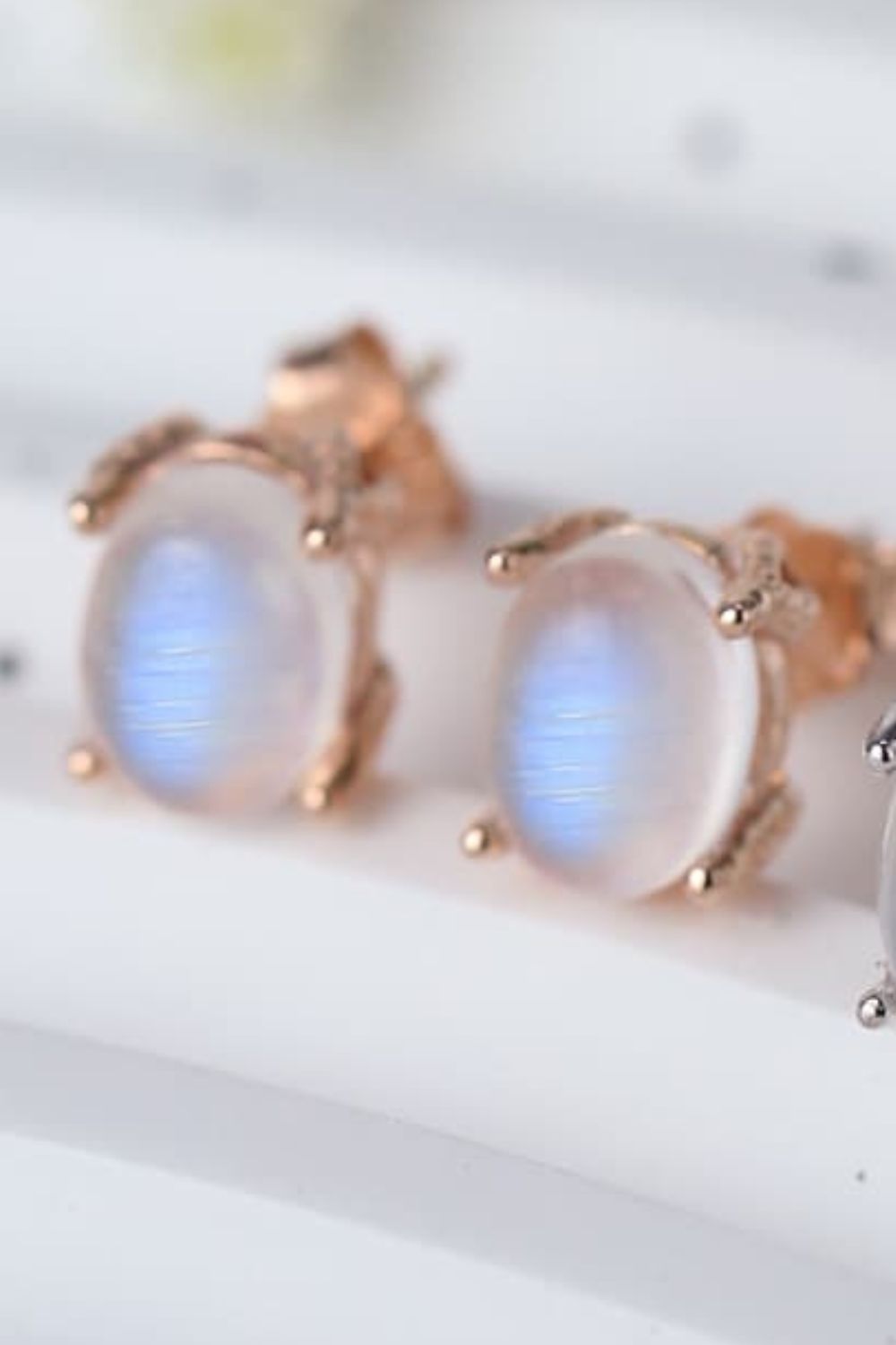 High Quality Natural Moonstone 925 Sterling Silver Stud Earrings showcasing translucent white and blue-violet hues, set in elegant sterling silver.