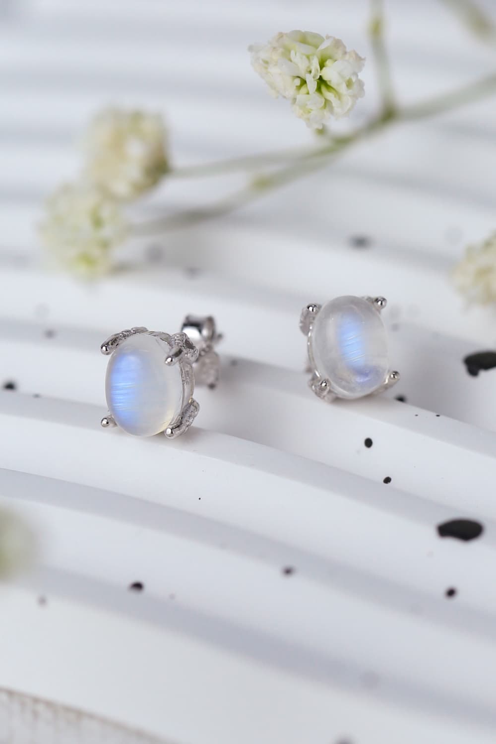 High Quality Natural Moonstone 925 Sterling Silver Stud Earrings showcasing translucent white and blue-violet hues, set in elegant sterling silver.