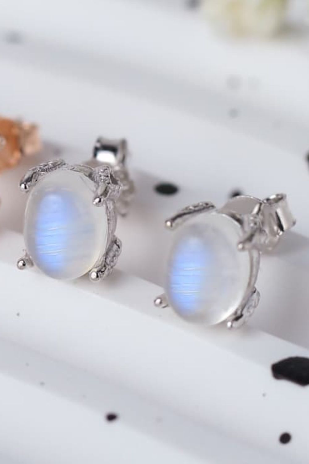 High Quality Natural Moonstone 925 Sterling Silver Stud Earrings showcasing translucent white and blue-violet hues, set in elegant sterling silver.