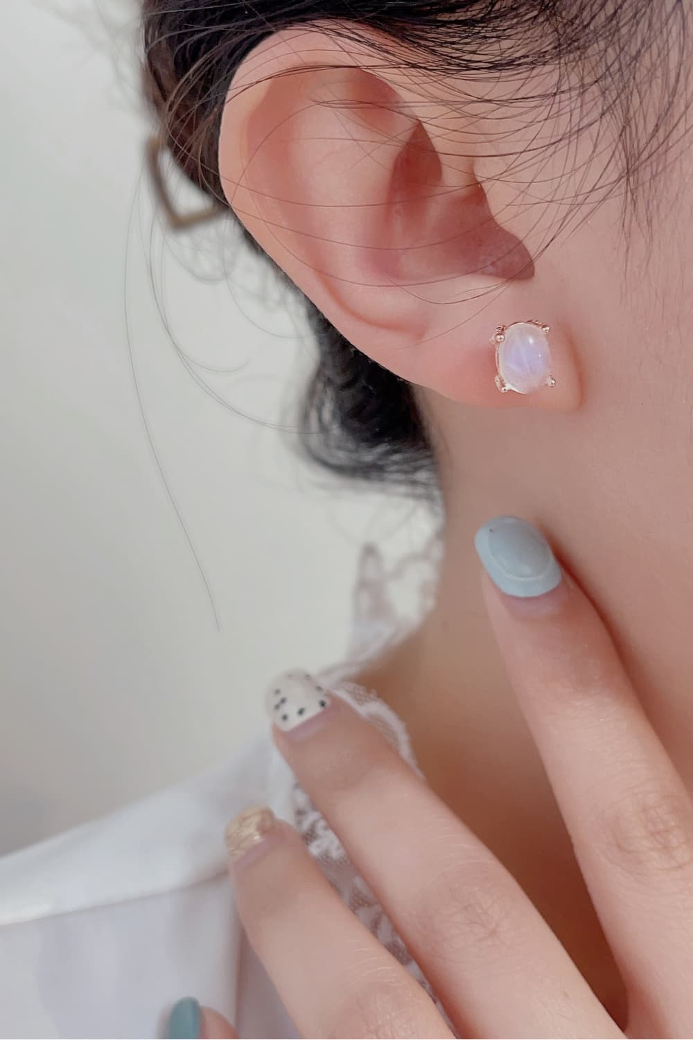 High Quality Natural Moonstone 925 Sterling Silver Stud Earrings showcasing translucent white and blue-violet hues, set in elegant sterling silver.