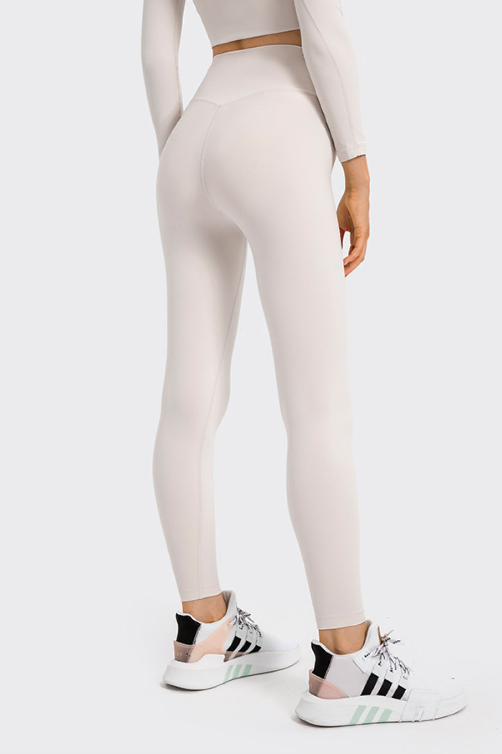 High Rise Crop Fitness Leggings in solid color, showcasing a slim fit and high-rise design, perfect for workouts.