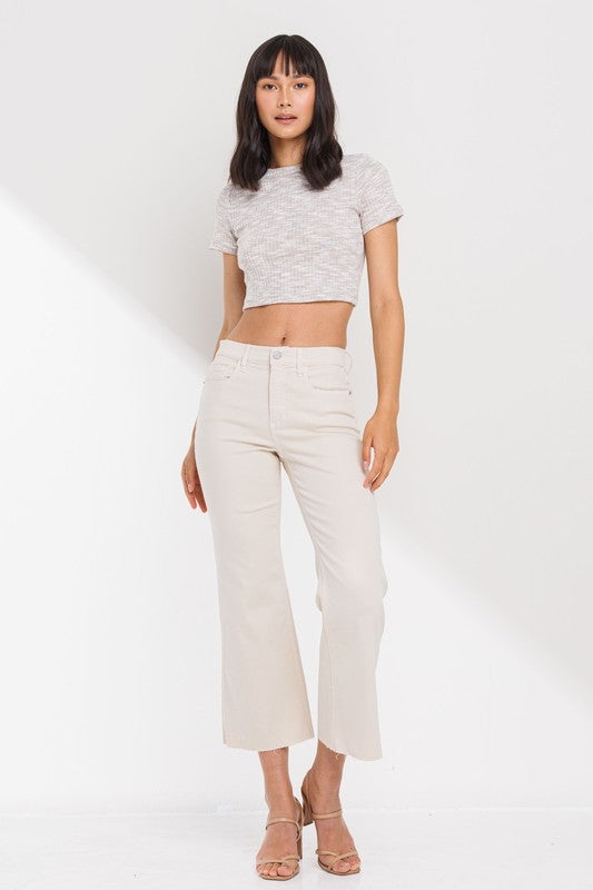 High Rise Cropped Kick Flare jeans with raw scissor cut hem, displayed on a model standing 5'11" wearing size 26.