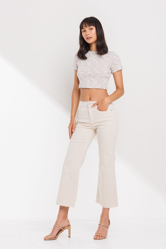 High Rise Cropped Kick Flare jeans with raw scissor cut hem, displayed on a model standing 5'11" wearing size 26.