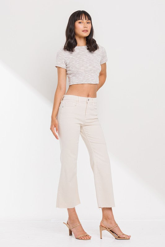 High Rise Cropped Kick Flare jeans with raw scissor cut hem, displayed on a model standing 5'11" wearing size 26.