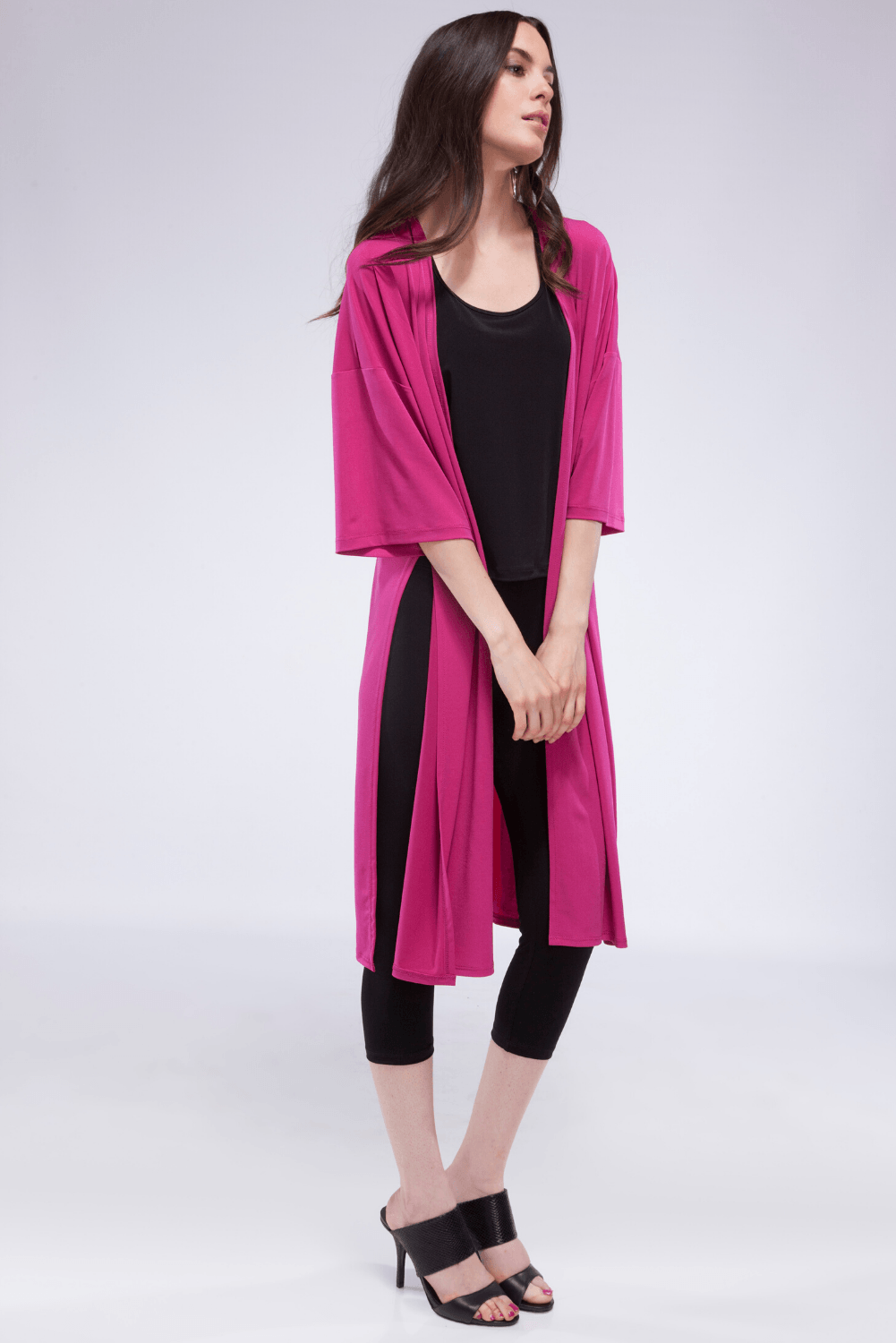 A stylish High Slit Cardigan featuring high side slits, made from a soft polyester blend, perfect for layering over various outfits.