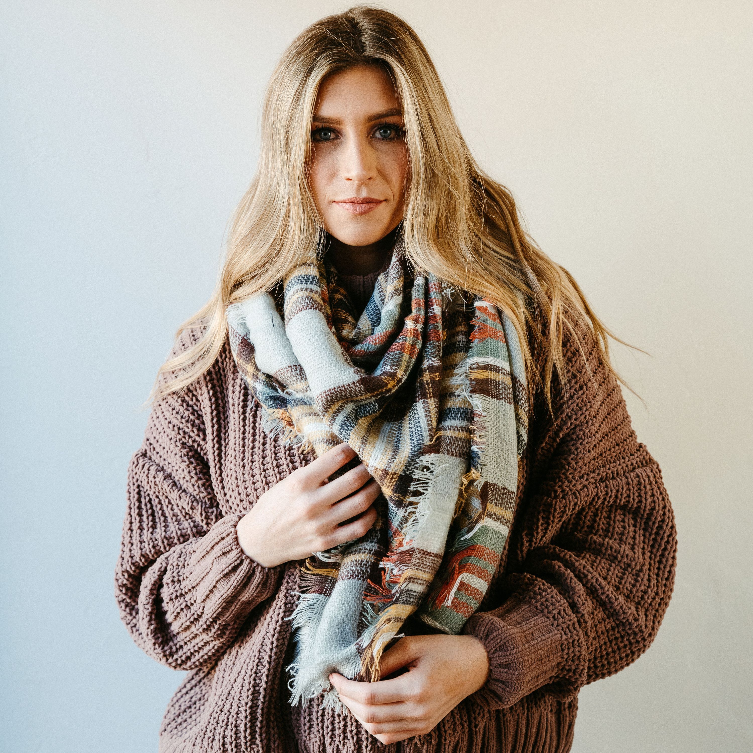 High Street Blanket Scarf in Gray Mustard, showcasing its soft texture and stylish design, perfect for warmth and versatility.