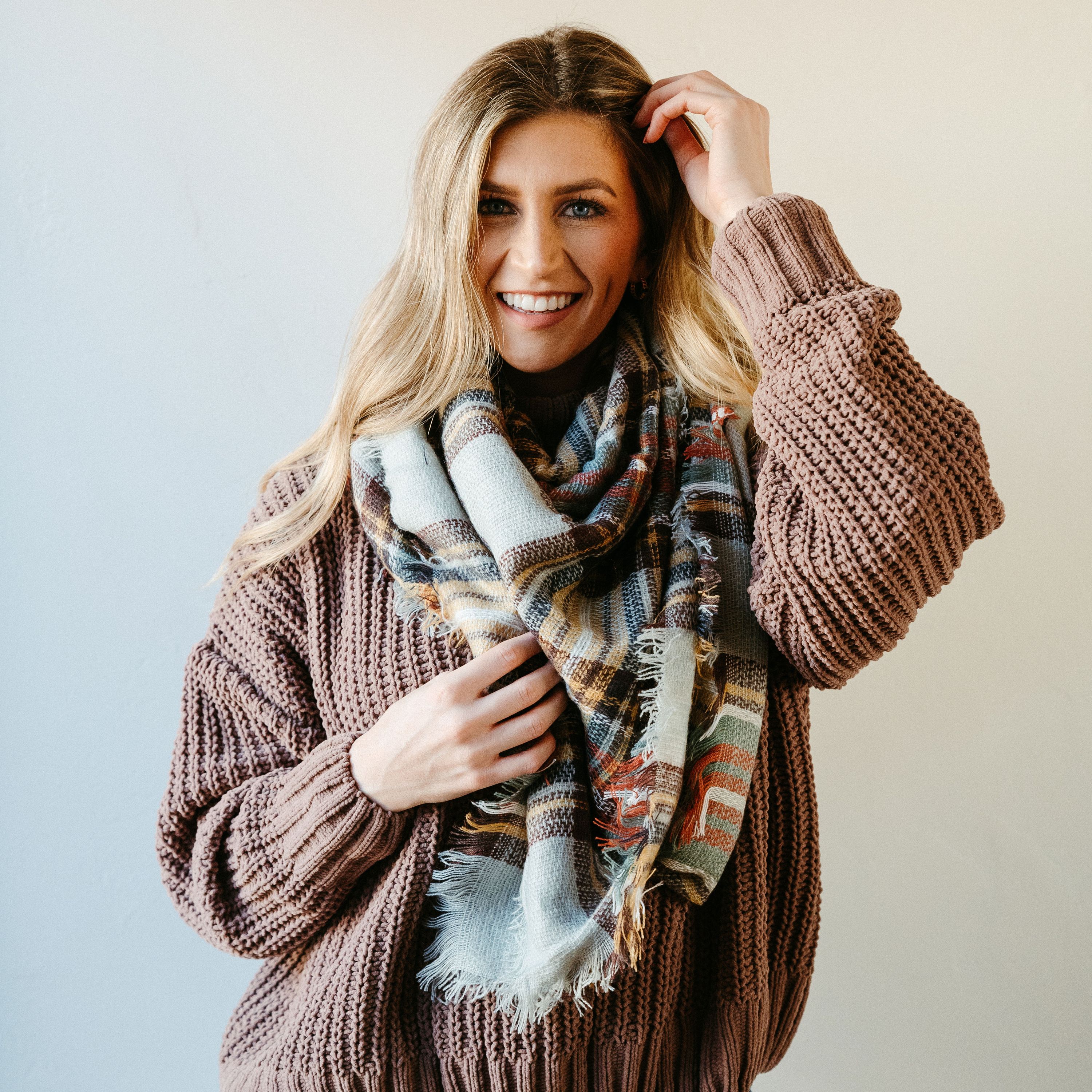 High Street Blanket Scarf in Gray Mustard, showcasing its soft texture and stylish design, perfect for warmth and versatility.