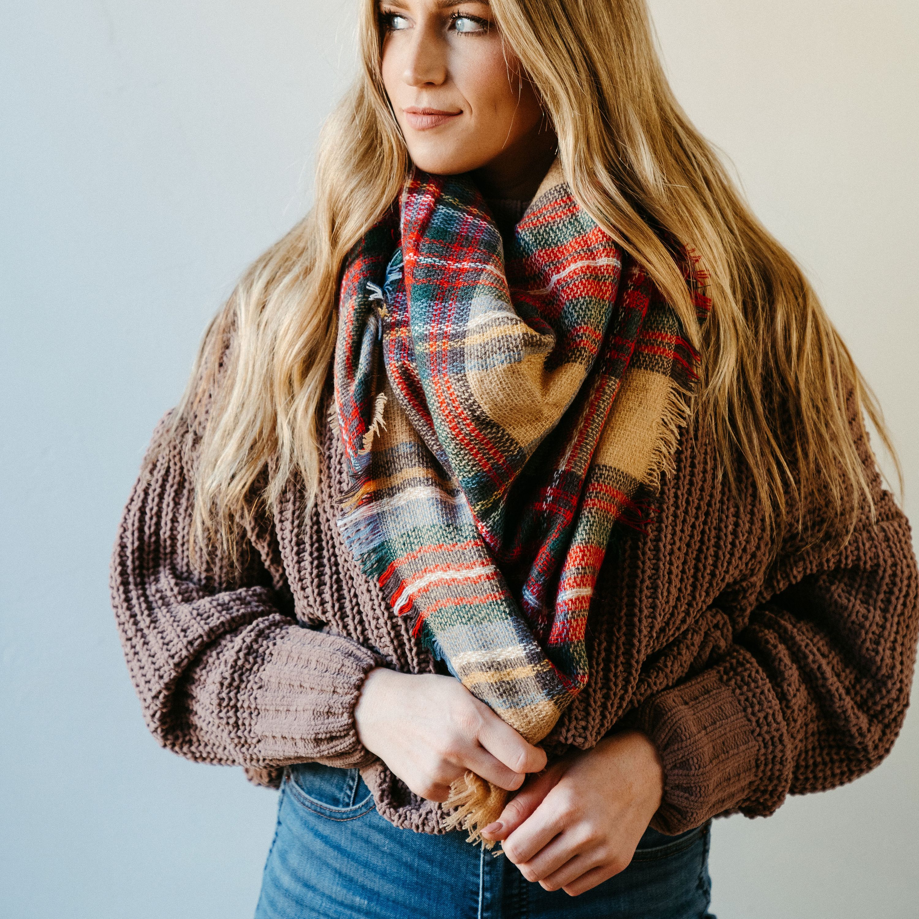 High Street Blanket Scarf in Khaki, showcasing its soft texture and generous size, perfect for versatile styling and cozy comfort.