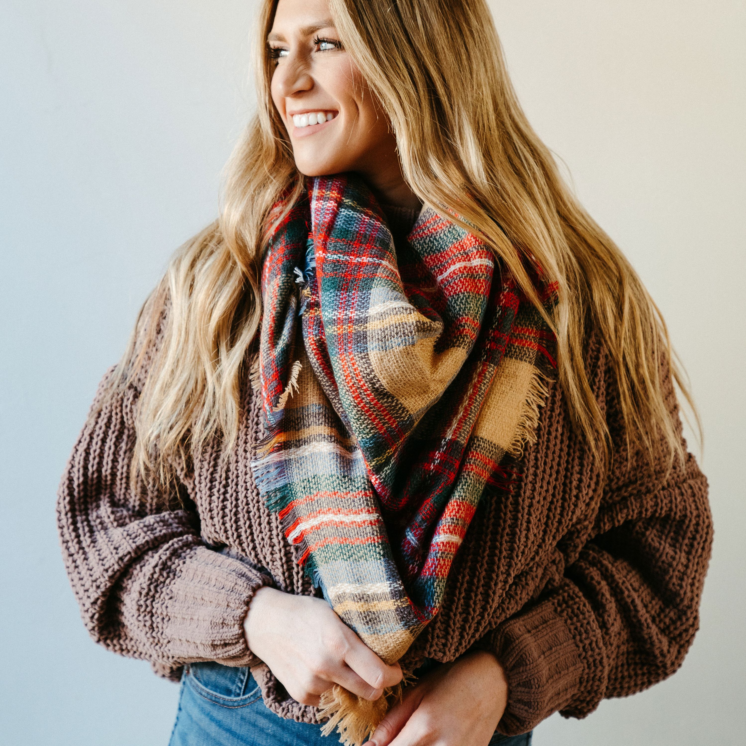 High Street Blanket Scarf in Khaki, showcasing its soft texture and generous size, perfect for versatile styling and cozy comfort.