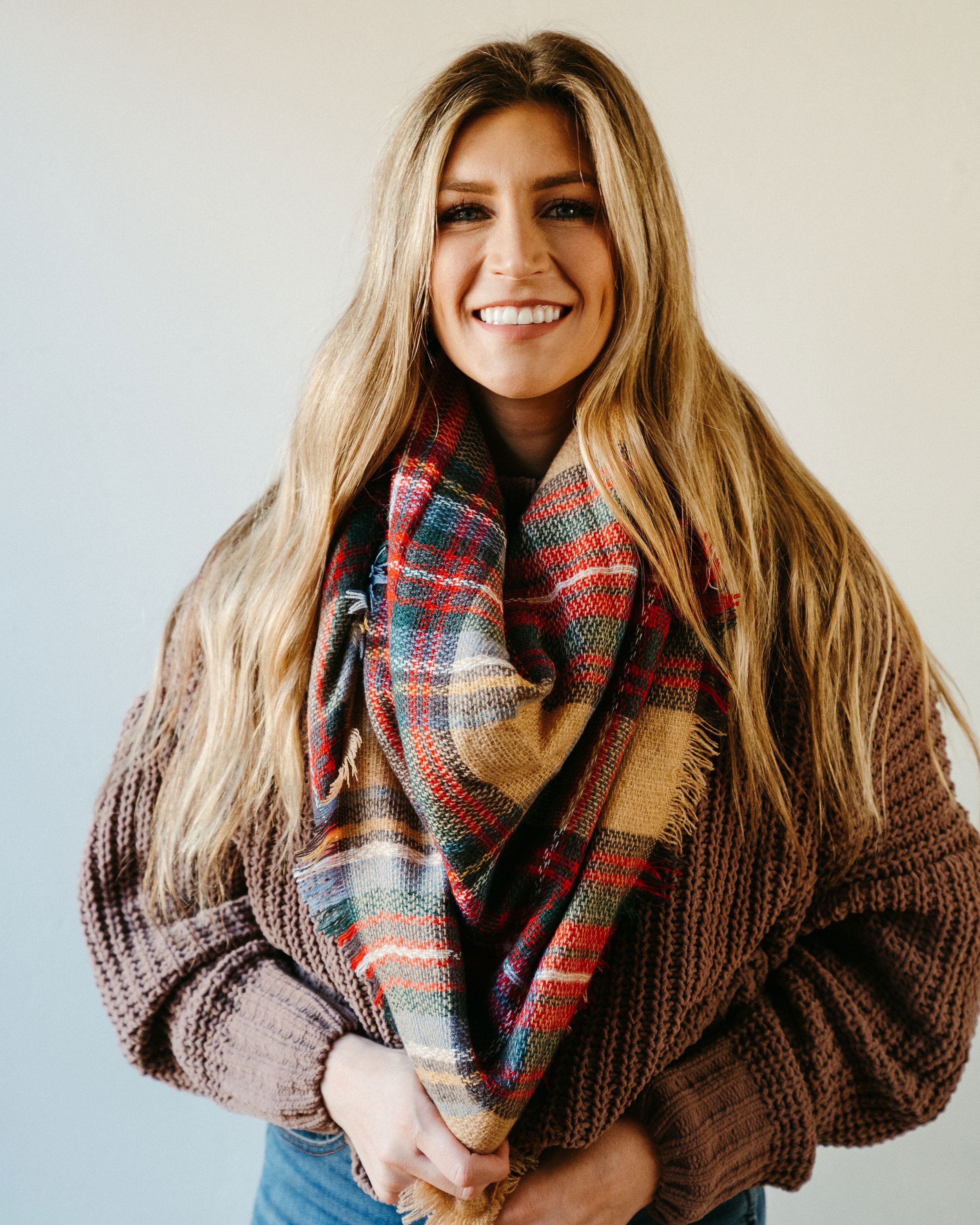 High Street Blanket Scarf in Khaki, showcasing its soft texture and generous size, perfect for versatile styling and cozy comfort.