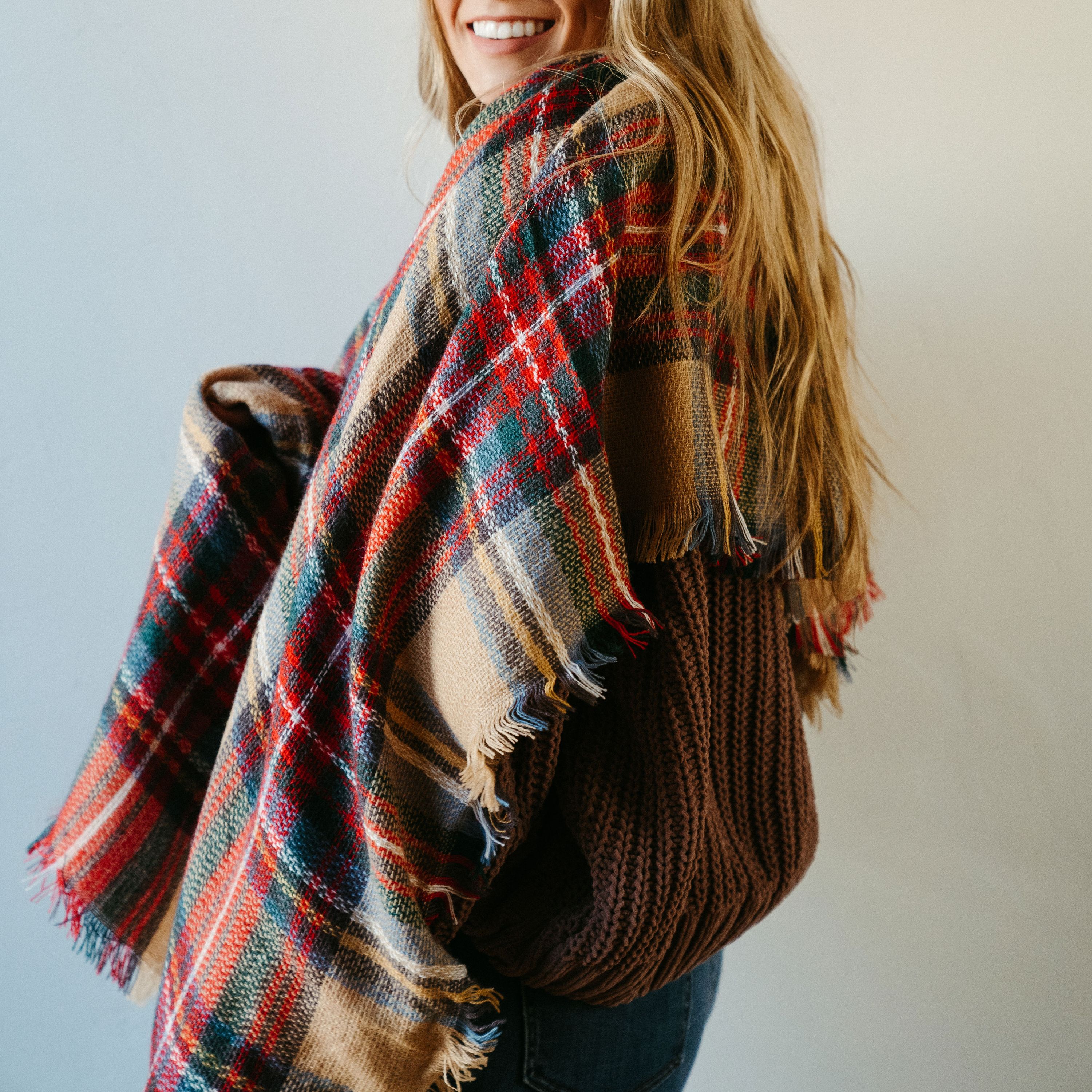 High Street Blanket Scarf in Khaki, showcasing its soft texture and generous size, perfect for versatile styling and cozy comfort.