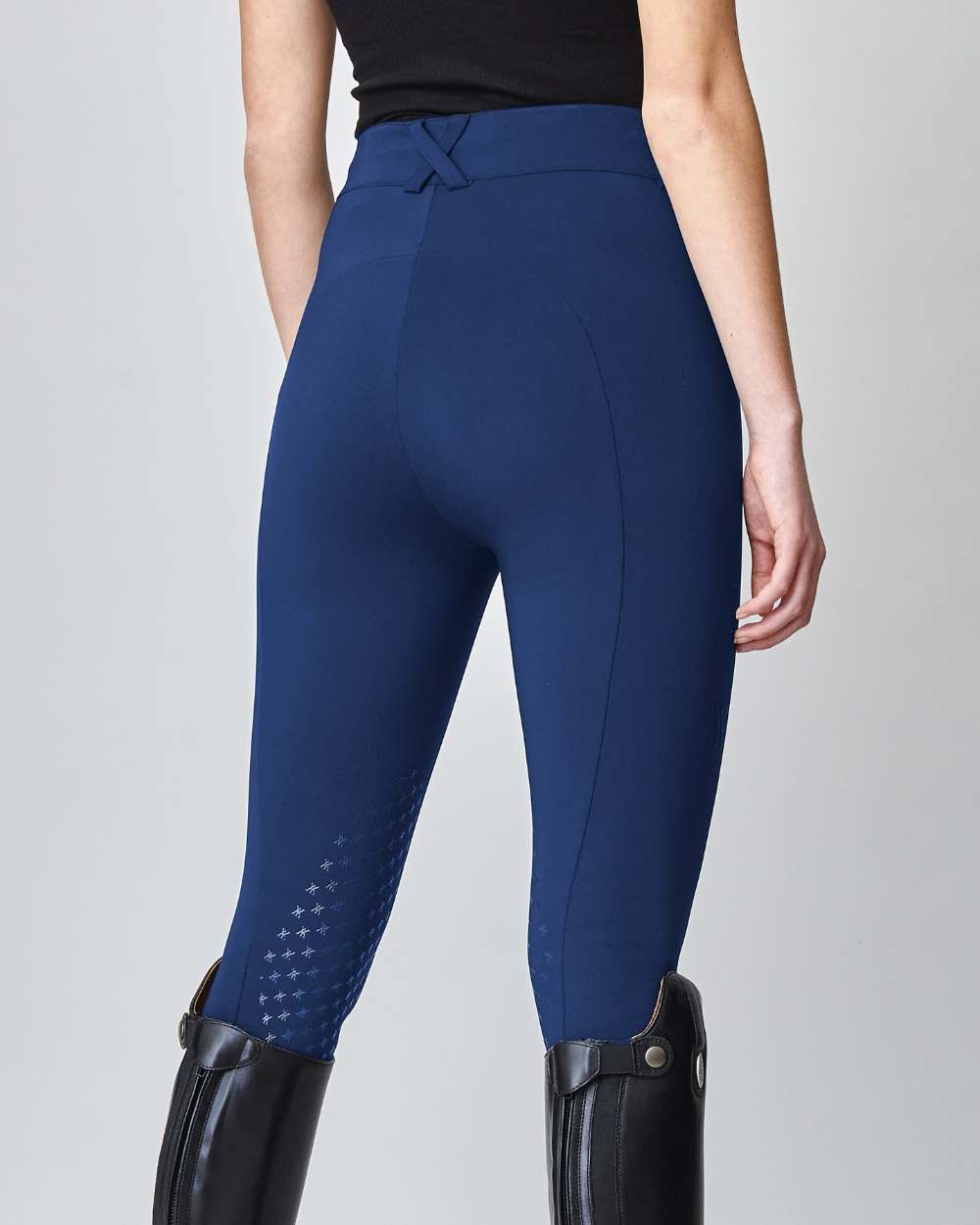 High-Rise Compression Breeches in Navy, featuring a high-rise fit, zipper, and belt loops, crafted from lightweight Italian jersey fabric.