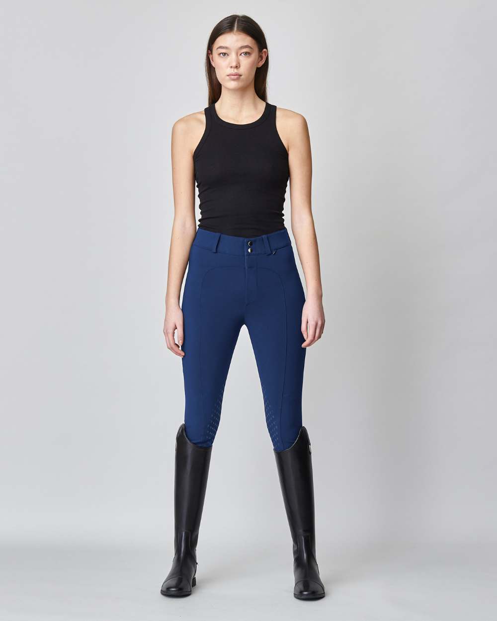 High-Rise Compression Breeches in Navy, featuring a high-rise fit, zipper, and belt loops, crafted from lightweight Italian jersey fabric.