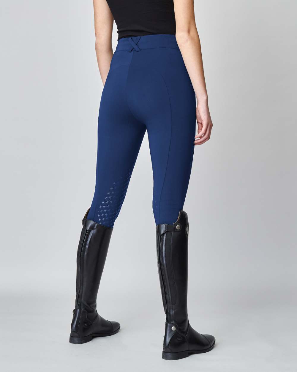 High-Rise Compression Breeches in Navy, featuring a high-rise fit, zipper, and belt loops, crafted from lightweight Italian jersey fabric.