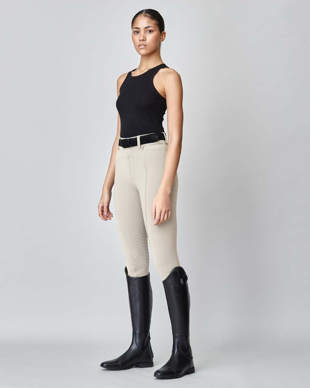 High-Rise Compression Breeches in Tan, featuring a high waist, zipper, and belt loops, made from lightweight Italian jersey fabric.