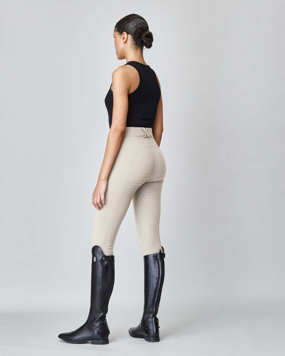 High-Rise Compression Breeches in Tan, featuring a high waist, zipper, and belt loops, made from lightweight Italian jersey fabric.