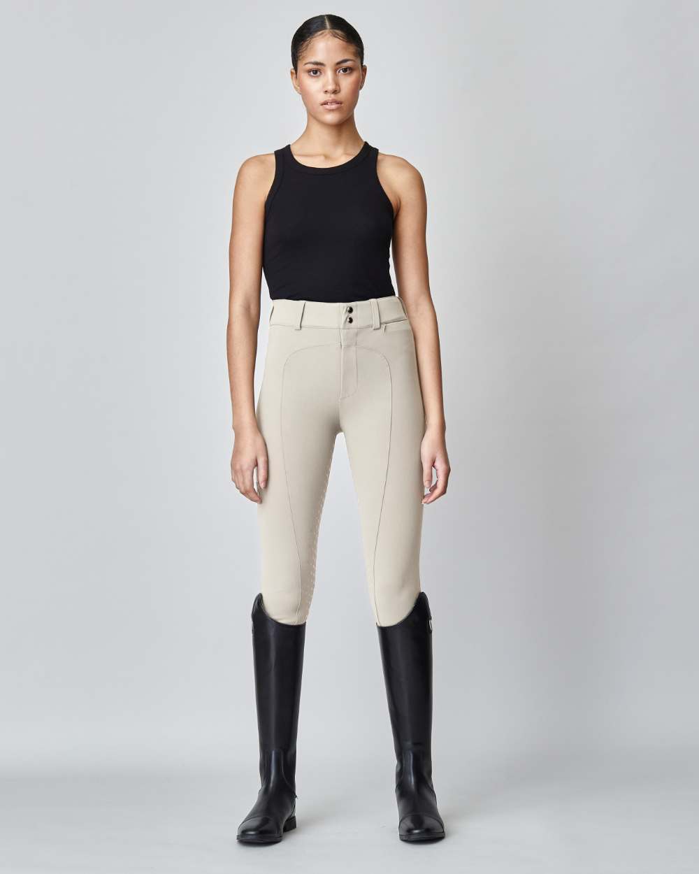 High-Rise Compression Breeches in Tan, featuring a high waist, zipper, and belt loops, made from lightweight Italian jersey fabric.