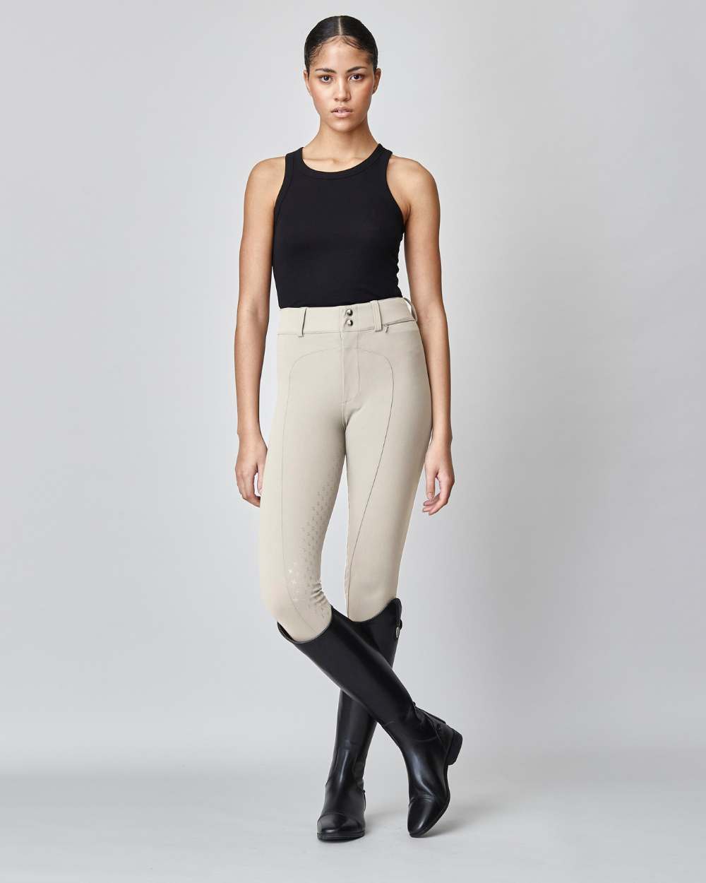 High-Rise Compression Breeches in Tan, featuring a high waist, zipper, and belt loops, made from lightweight Italian jersey fabric.