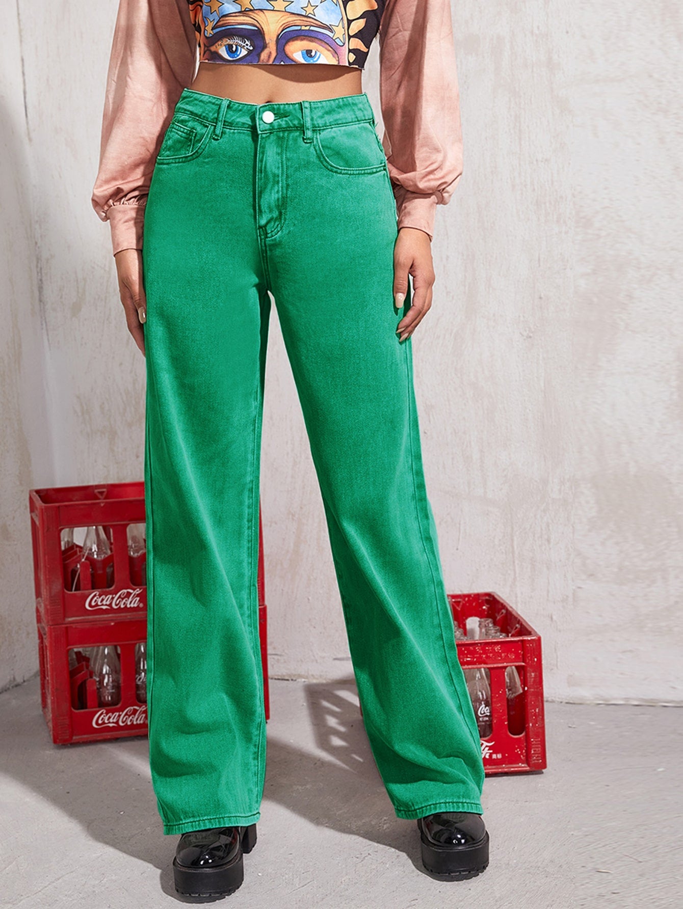 High-Rise Pocketed Wide Leg Jeans displayed in a studio setting, showcasing their stylish design and high-quality fabric.