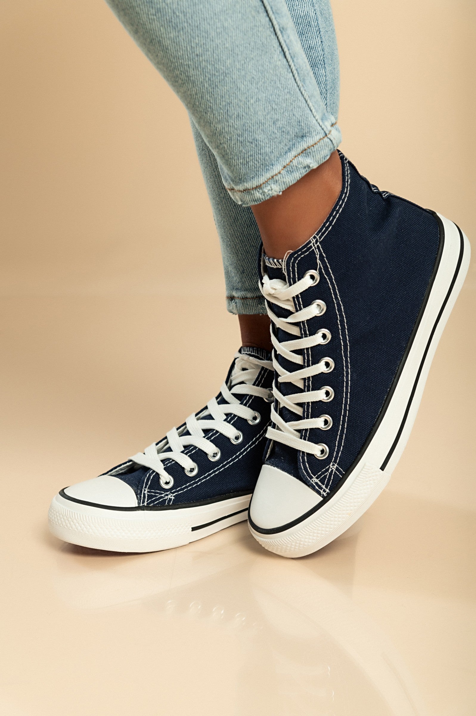 Dark blue high-top canvas sneakers with lace-up fastening and round plastic toe, showcasing a stylish and comfortable design.