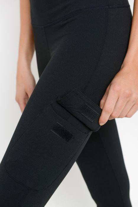 Highwaist cargo leggings featuring Velcro pockets, designed for comfort and style, showcasing a ribbed waistband and deep square pockets.