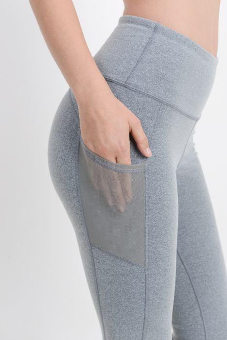 Highwaist Essential Leggings featuring mesh pockets, made from Supplex and Lycra blend, ideal for workouts and casual wear.