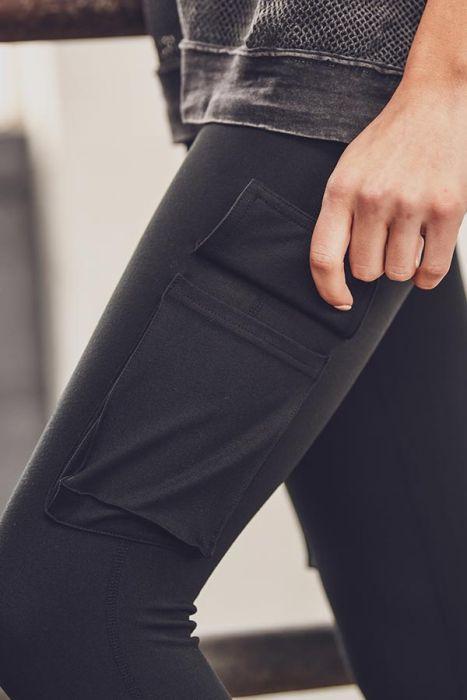 Highwaist Hybrid Cargo Adventurer Leggings featuring cargo pockets, made from polyester-spandex blend, ideal for hiking and rock climbing.