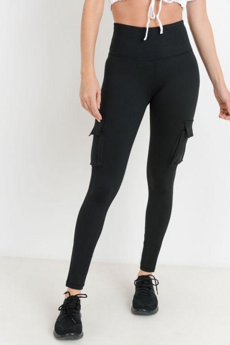 Highwaist Hybrid Cargo Adventurer Leggings featuring cargo pockets, made from polyester-spandex blend, ideal for hiking and rock climbing.