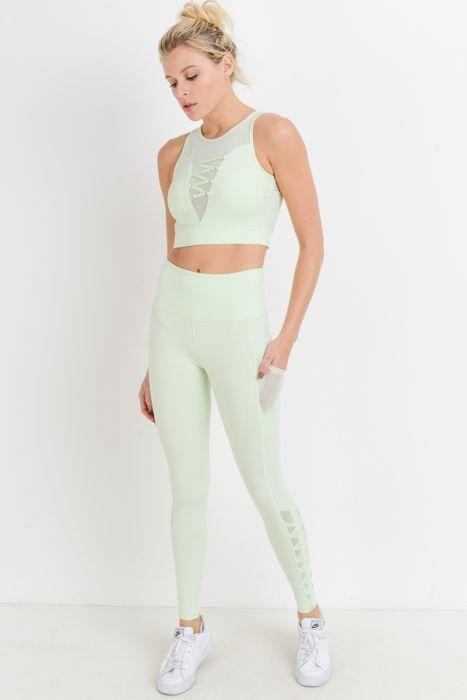 Highwaist Hybrid Mesh & Lattice Straps Full Pocket Leggings featuring stylish mesh panels and convenient side pockets.