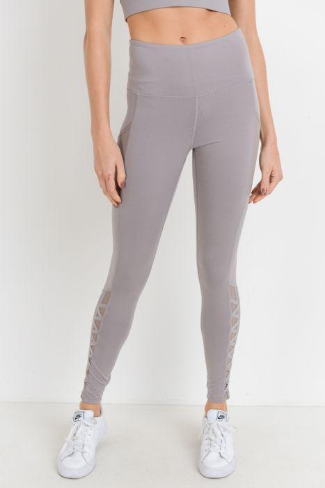 Highwaist Hybrid Mesh & Lattice Straps Full Pocket Leggings featuring stylish mesh panels and convenient side pockets.