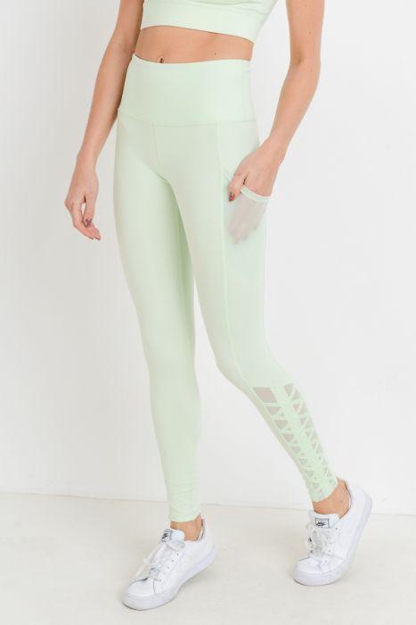 Highwaist Hybrid Mesh & Lattice Straps Full Pocket Leggings featuring stylish mesh panels and convenient side pockets.